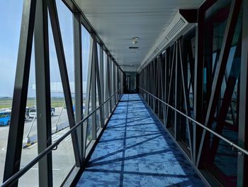 Low angle view of empty corridor in building