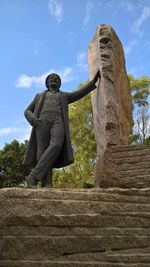 Low angle view of statue against sky