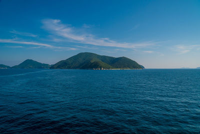 Scenic view of sea against blue sky