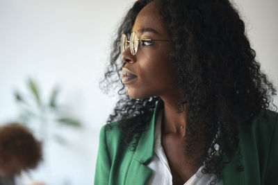 Portrait of a businesswoman in office looking sideways