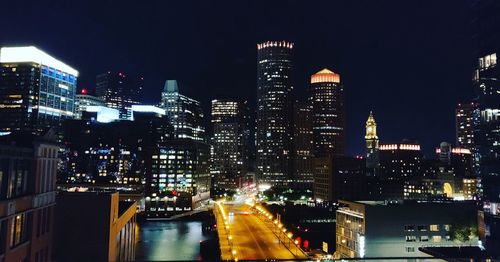 Illuminated buildings in city at night