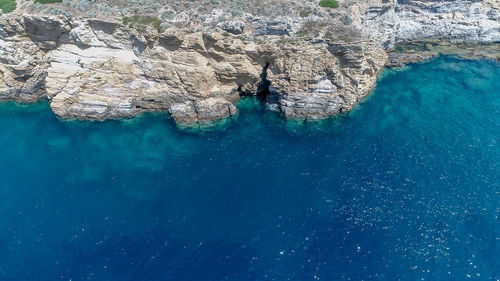 Aerial view of rock formation in sea
