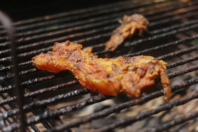 Close-up of meat on barbecue grill