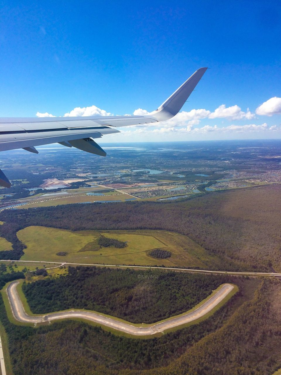 flying, airplane, air vehicle, transportation, landscape, aircraft wing, mode of transport, aerial view, mid-air, blue, part of, scenics, sky, travel, cropped, beauty in nature, mountain, nature, public transportation, tranquil scene