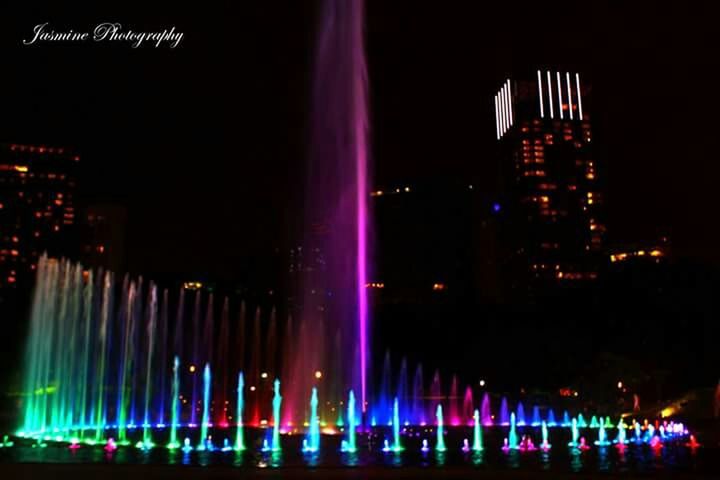 illuminated, night, architecture, building exterior, built structure, city, skyscraper, modern, sky, cityscape, tall - high, tower, long exposure, travel destinations, office building, lighting equipment, light - natural phenomenon, outdoors, low angle view, reflection