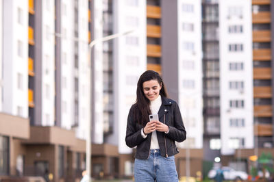 Young woman using mobile phone