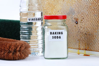 High angle view of bottles in glass on table