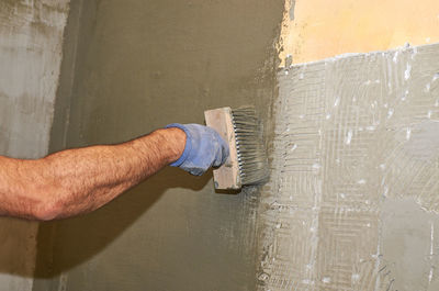 Man working on wall