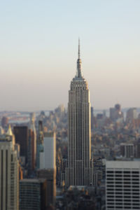 Tilt-shift image of empire state building amidst city