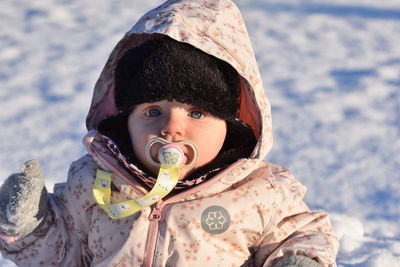 Portrait of smiling young woman holding ice cream