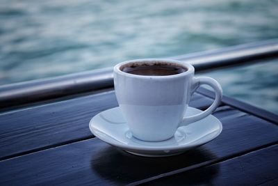 Close-up of coffee cup on table