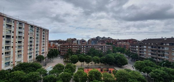 Buildings in city against sky