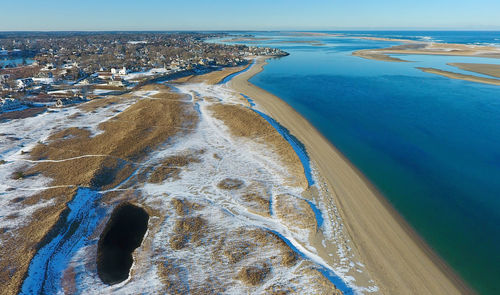 High angle view of city by sea