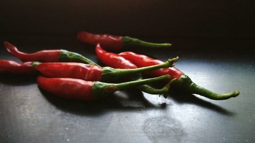 Close-up of chili peppers on table