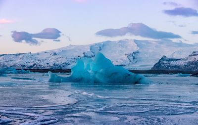 Scenic view of frozen sea against sky