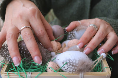 Midsection of man holding seashells