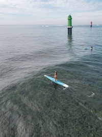 Aerial view of sup surfers
