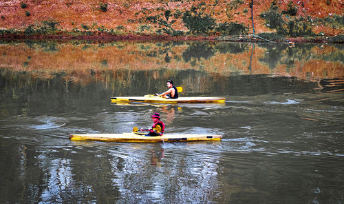 People on boat in river