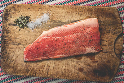 High angle view of fish on cutting board