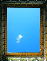 Low angle view of building against blue sky