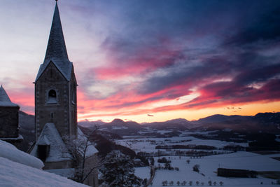 Buildings against sky during winter