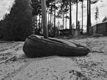 Abandoned boat on shore at beach