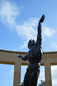 Low angle view of statue against sky