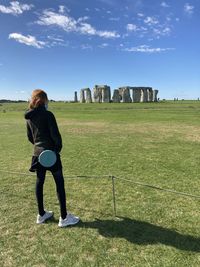 Full length of woman on field against sky