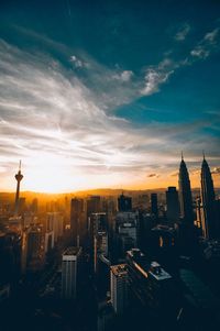 High angle view of buildings against sky during sunset