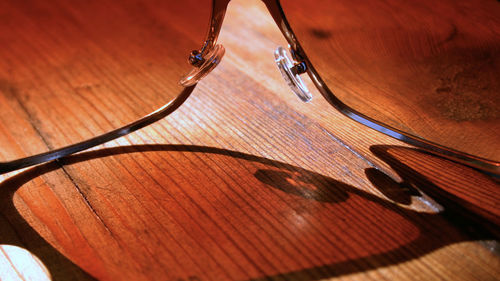 Close-up of guitar on table