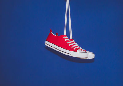 Canvas shoes against blue background