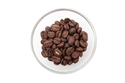 High angle view of coffee beans against white background