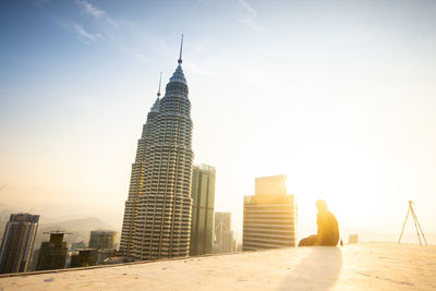 Modern buildings in city against sky