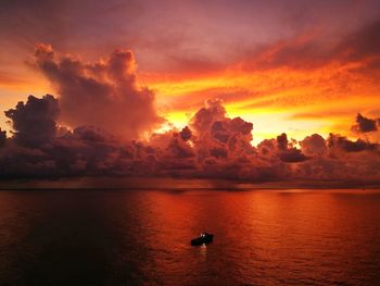 Scenic view of sea against orange sky