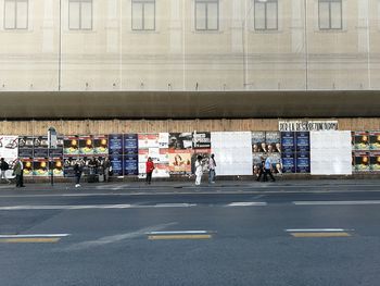 People on road in city