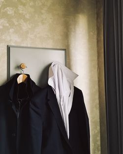 Close-up of clothes hanging at home