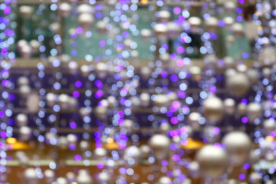 Defocused image of illuminated lights at night