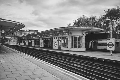 Train at railroad station against sky