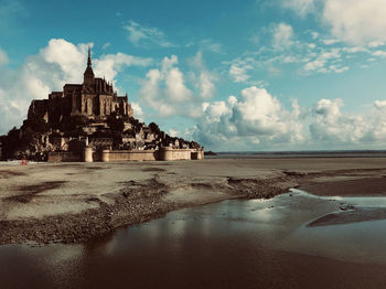 Scenic view of beach against sky