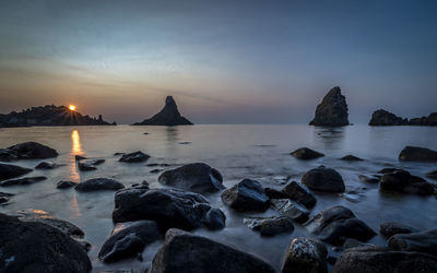 Scenic view of sea against sky at sunset