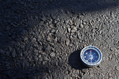 High angle view of arrow symbol on road