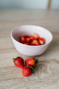 High angle view of strawberries in bowl on table