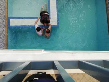 High angle view of man swimming in pool