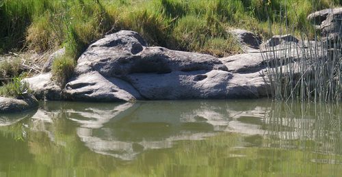 Reflection of rocks in lake