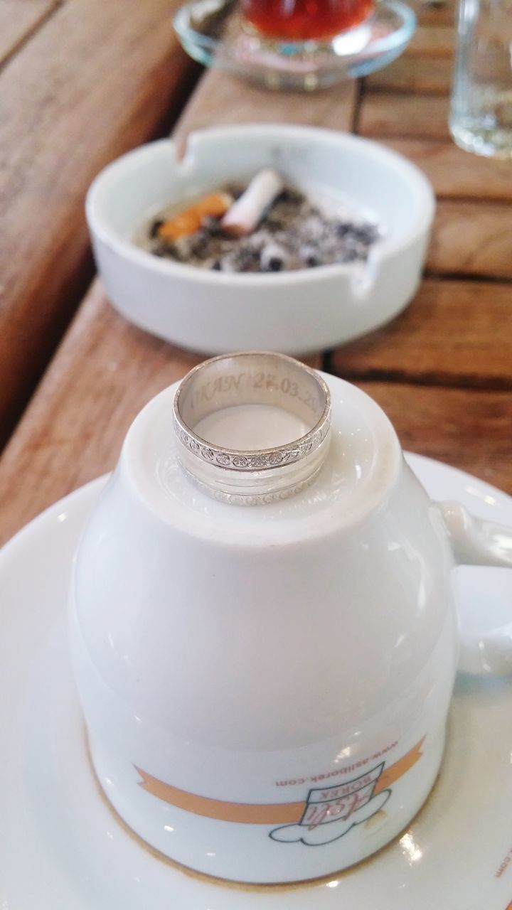 food and drink, indoors, drink, table, refreshment, freshness, coffee cup, still life, saucer, coffee - drink, spoon, cup, high angle view, close-up, plate, coffee, drinking glass, food, wood - material, tea cup