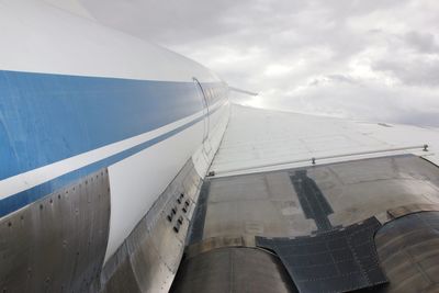 Low angle view of airplane against sky
