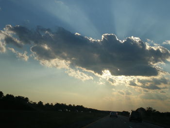 Scenic view of landscape against cloudy sky