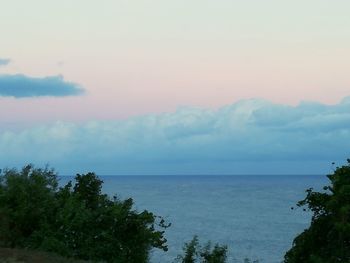 Scenic view of sea against sky at sunset