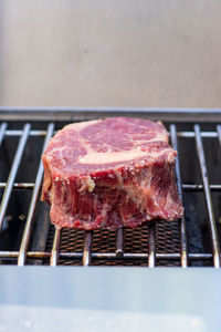 Close-up of meat on barbecue grill