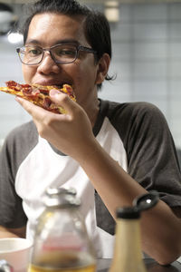 Portrait of woman holding ice cream in restaurant